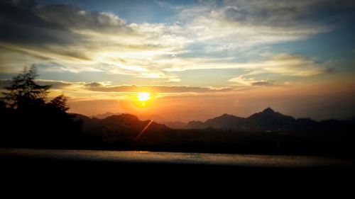 Scenic view of silhouette landscape against sky during sunset