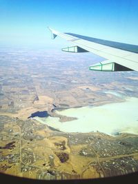 Aerial view of airplane flying over landscape