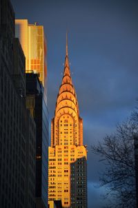 Low angle view of buildings against sky at dusk