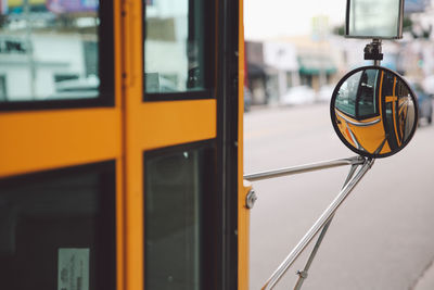 Close-up of yellow car against sky