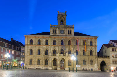 Facade of historic building at night