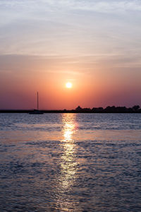 Scenic view of sea against dramatic sky