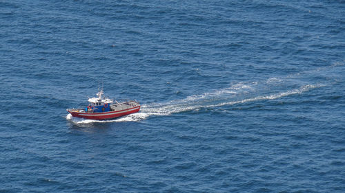 High angle view of ship sailing in sea