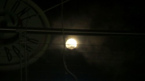 Close-up of illuminated lamp at night