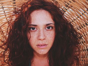 Close-up portrait of young woman with wicker basket