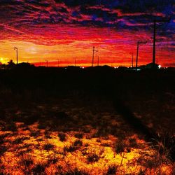 Scenic view of landscape against sky at sunset