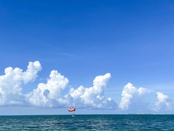 Scenic view of sea against blue sky