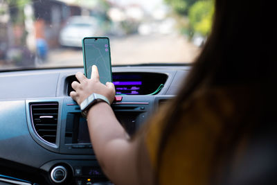 Man using mobile phone in car