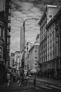 City street and buildings against sky