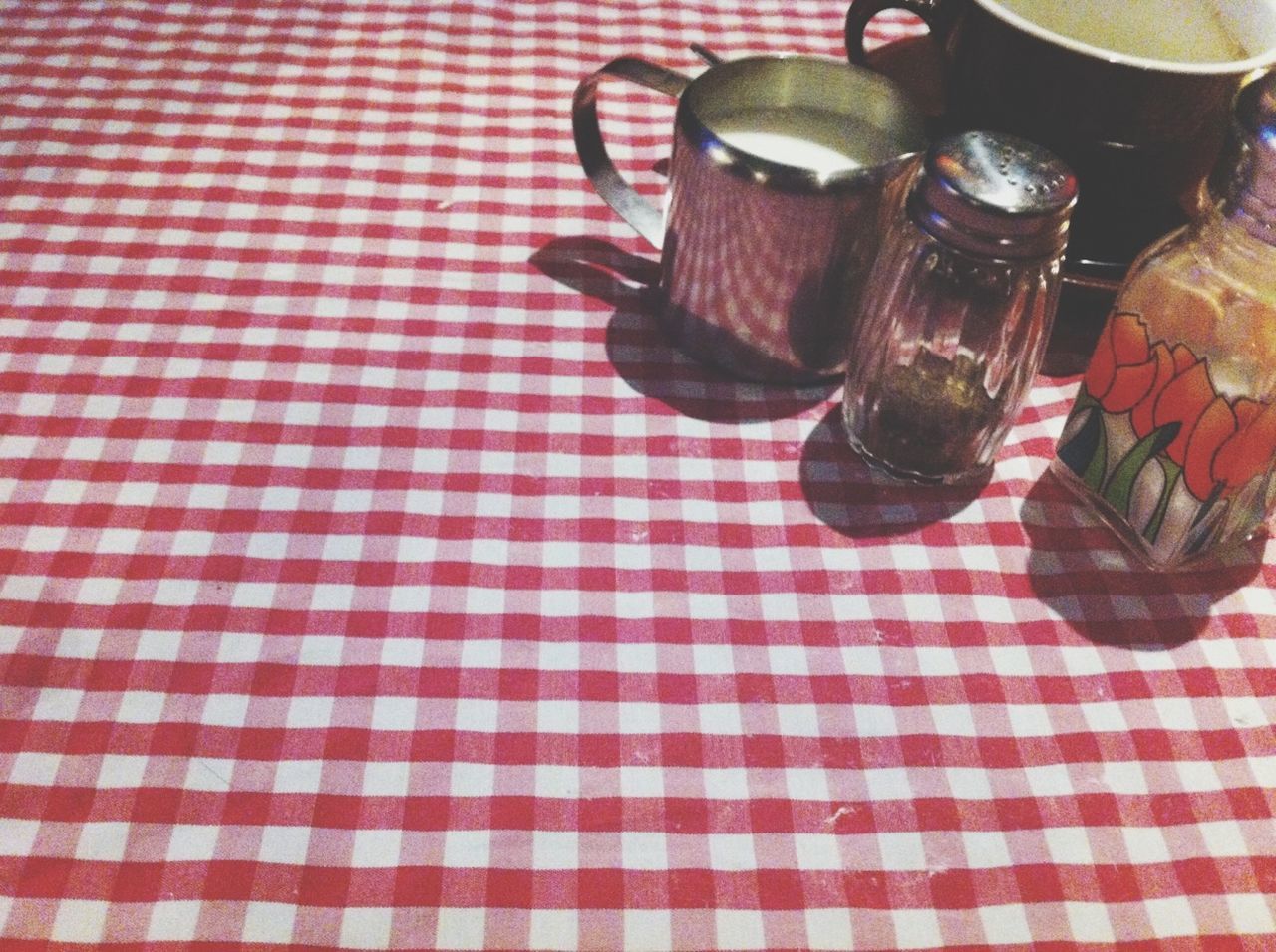 indoors, table, still life, drink, food and drink, high angle view, coffee cup, refreshment, tablecloth, drinking glass, close-up, cup, no people, absence, empty, freshness, tea cup, fork, container, bottle