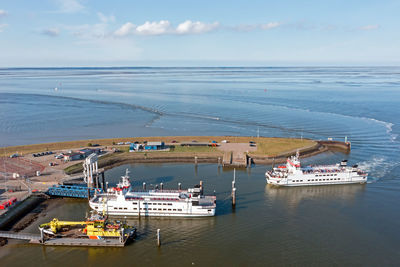 Aerial from the ferry from schiermonnikoog arriving in the harbor from lauwersoog in the netherlands