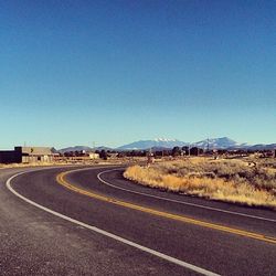 Empty road along landscape