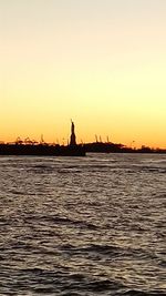 Silhouette of city at waterfront