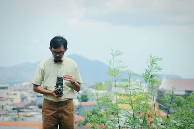 Woman standing against sky