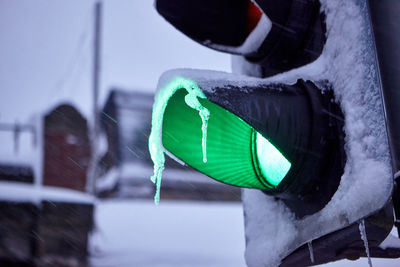 Close-up of road sign on snow