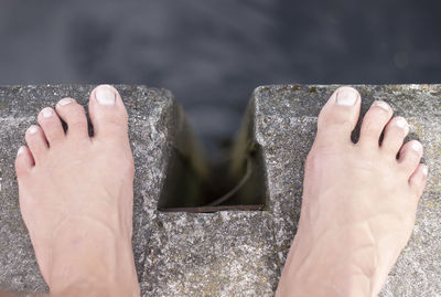 Low section of man legs in water