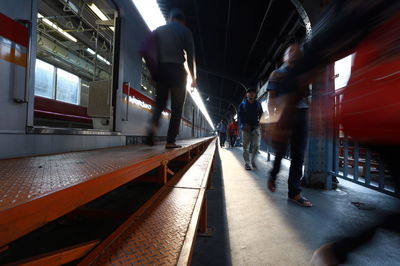 Blurred motion of train at railroad station