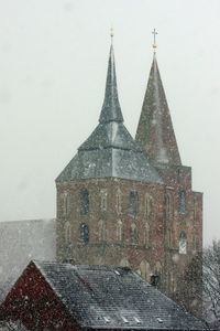 Close-up of cathedral against sky during winter