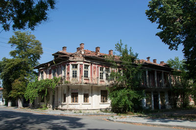 Low angle view of building against clear blue sky