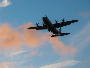 Low angle view of airplane flying in sky