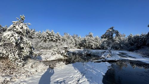 Snow covered mountain against clear blue sky
