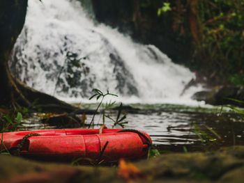 Close-up of red water flowing in river