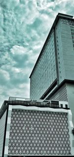 Low angle view of modern building against sky