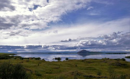 Scenic view of landscape against cloudy sky