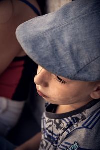 Close-up of boy wearing flat cap