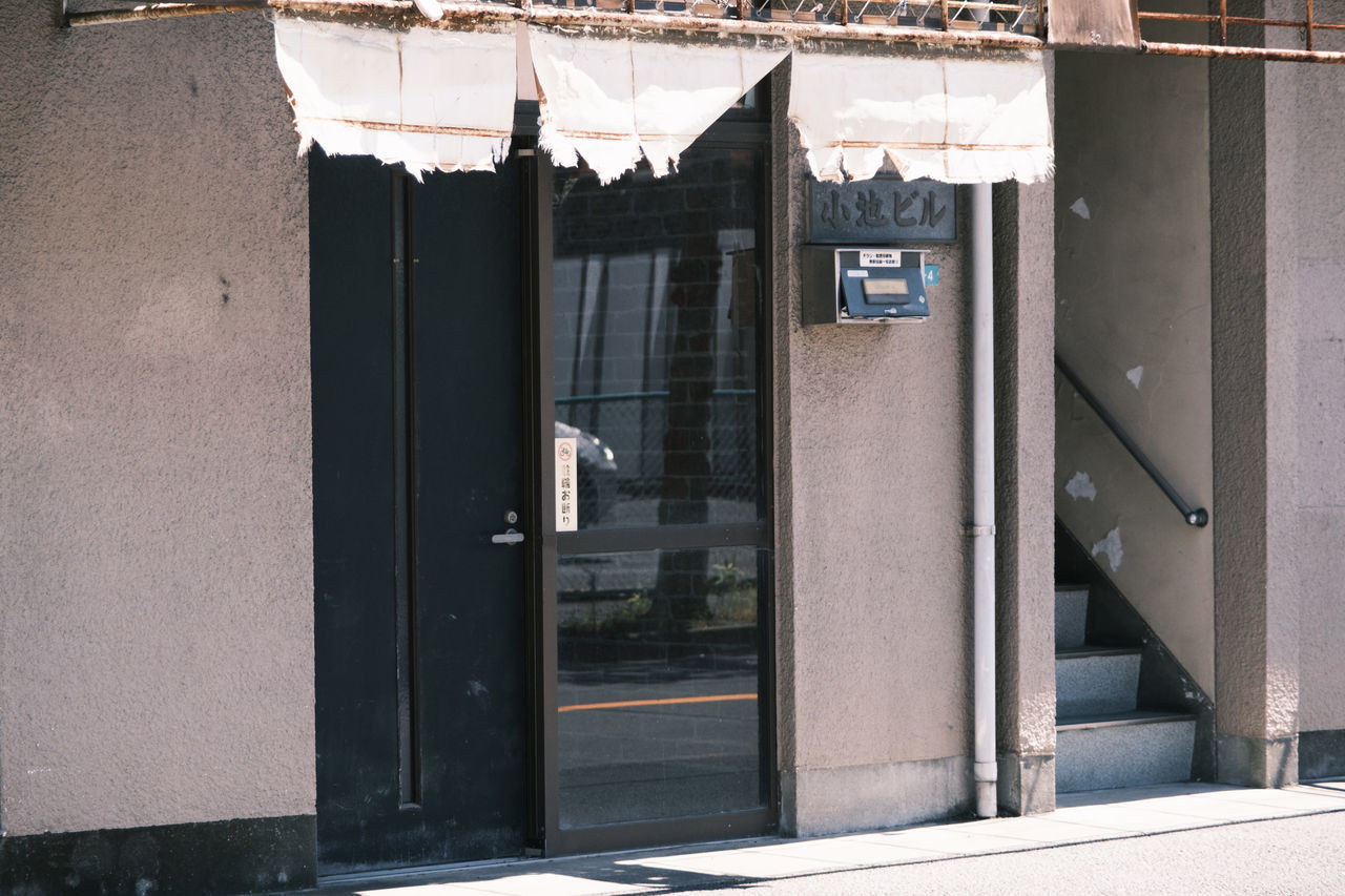 BUILDINGS SEEN THROUGH CLOSED WINDOW