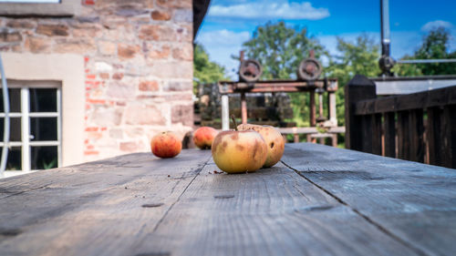 Fruits on table against building
