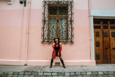 Full length of woman standing in city