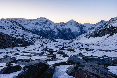 Scenic view of snow covered mountains against sky