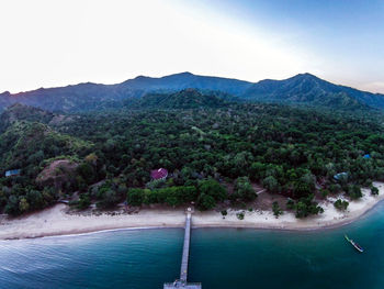 Scenic view of sea against mountain range