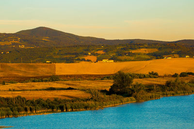 Scenic view of landscape against sky during sunset