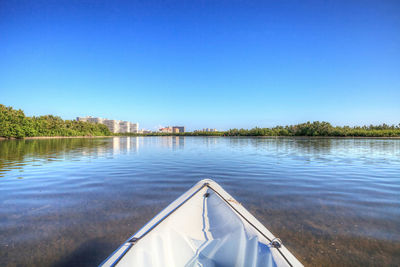Kayak glides through water along the coastline of marco island, florida near tigertail beach.