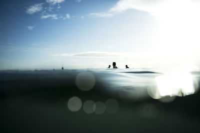 Surfer waiting for the series with the calm sea