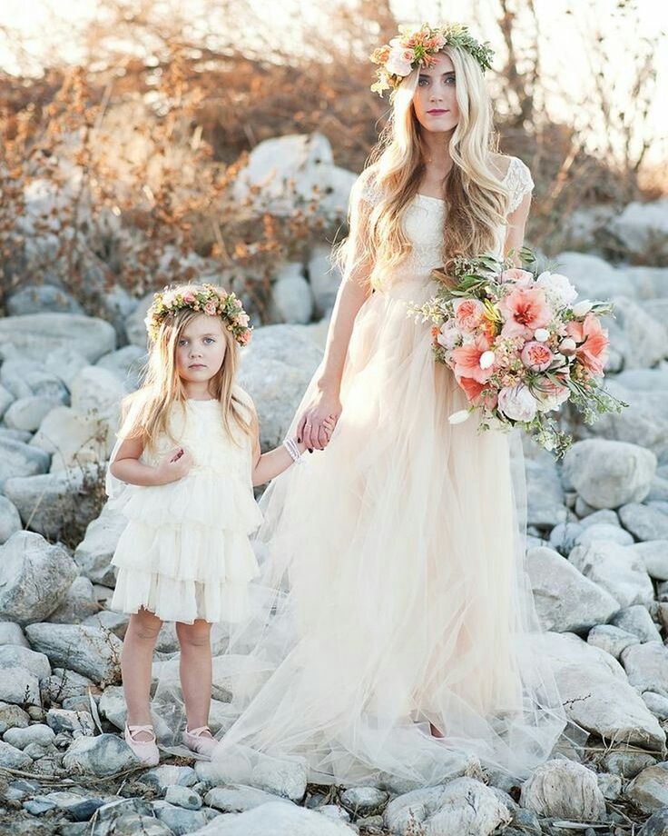 young women, lifestyles, leisure activity, full length, femininity, young adult, person, dress, long hair, rock - object, standing, bride, front view, wedding dress, smiling, looking at camera, focus on foreground, casual clothing, blond hair, in front of