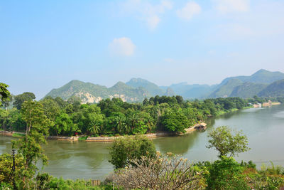 Scenic view of lake and mountains against sky