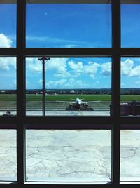 View of airport against cloudy sky