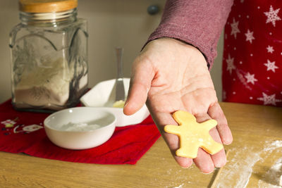 Happy woman making cookies in christmas bakery in home kitchen