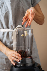 Midsection of woman preparing food