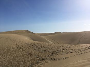 Scenic view of desert against clear sky