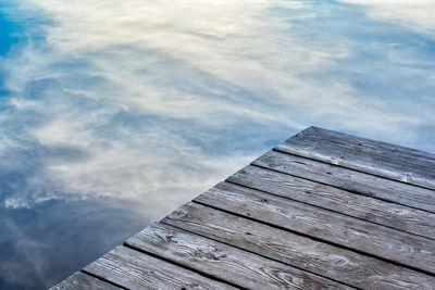 Close-up of pier by lake