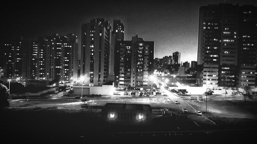 Illuminated lights against sky at night