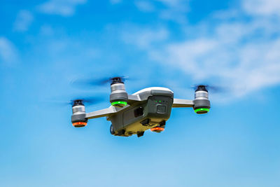 Low angle view of airplane flying in sky