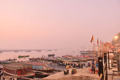 Panoramic view of boats in sea against clear sky