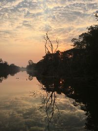 Scenic view of lake against sky during sunset