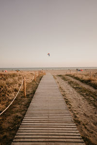 View of empty beach against clear sky