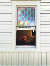 Reflection of building on glass window